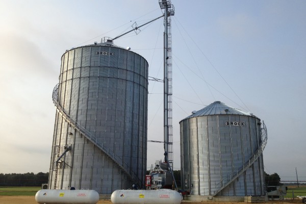 two Brock grain bins next to each other