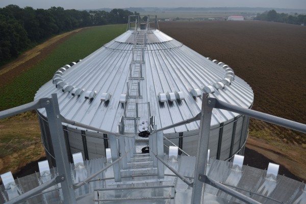 top of grain bin on a farm during a cloudy and foggy day