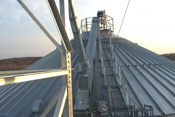 top of grain bin system in front of sunset