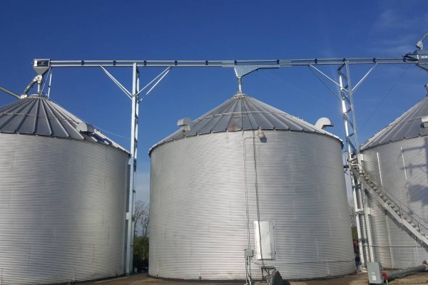 grain bins connected to each other by a system